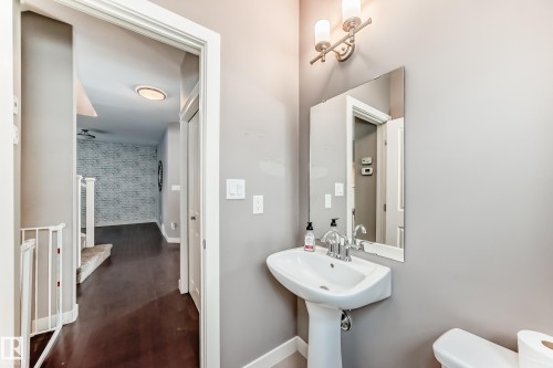 Bathroom featuring toilet and baseboards - 1908 69 Street, Edmonton, AB - Indoor Photo Showing Bathroom