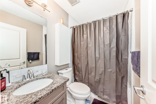 Full bathroom with vanity and shower / tub combo - 1908 69 Street, Edmonton, AB - Indoor Photo Showing Bathroom