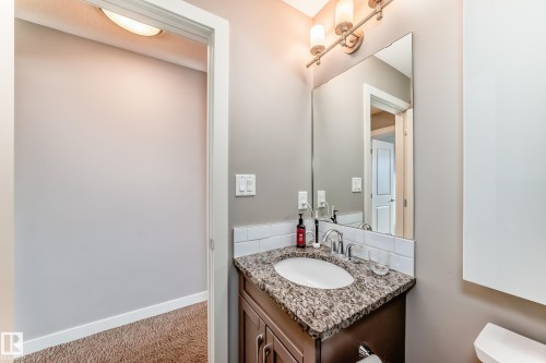 Half bathroom with vanity and light carpet - 1908 69 Street, Edmonton, AB - Indoor Photo Showing Bathroom