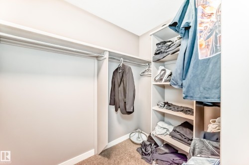 Walk in closet with light carpet - 1908 69 Street, Edmonton, AB - Indoor With Storage