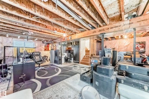 Below grade area featuring water heater - 1908 69 Street, Edmonton, AB - Indoor Photo Showing Basement