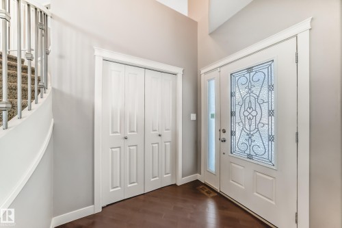 Foyer entrance with dark wood finished floors and stairway - 1908 69 Street, Edmonton, AB - Indoor Photo Showing Other Room