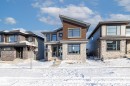View of front facade with stone siding - 4543 Knight Wynd, Edmonton, AB  - Outdoor With Facade 