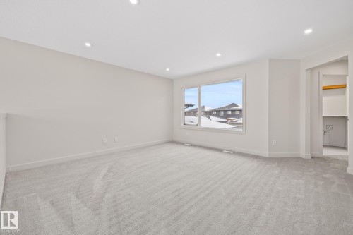 Unfurnished room with light carpet and recessed lighting - 4543 Knight Wynd, Edmonton, AB - Indoor Photo Showing Other Room