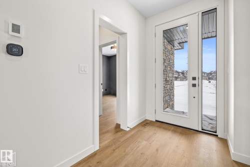 Entryway featuring wood finished floors and baseboards - 4543 Knight Wynd, Edmonton, AB - Indoor Photo Showing Other Room