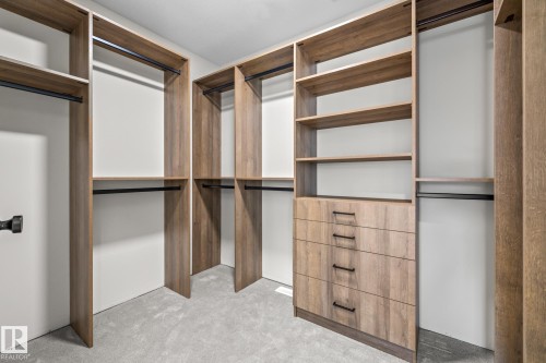 Walk in closet featuring light colored carpet - 4543 Knight Wynd, Edmonton, AB - Indoor