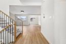 Hallway featuring stairway and light wood-type flooring - 4543 Knight Wynd, Edmonton, AB  - Indoor Photo Showing Other Room 