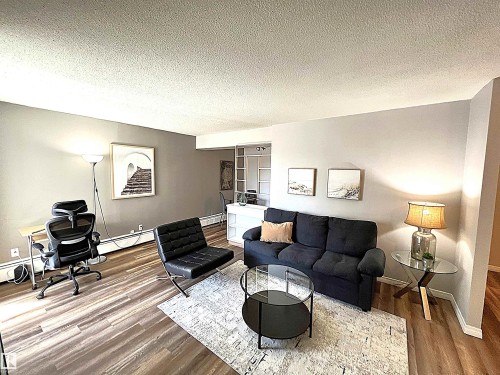 103 8310 Jasper Avenue, Edmonton, AB - Indoor Photo Showing Living Room