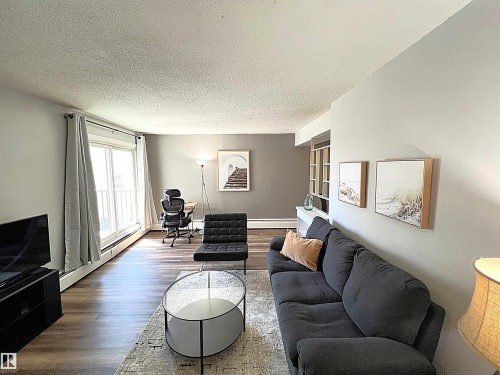 103 8310 Jasper Avenue, Edmonton, AB - Indoor Photo Showing Living Room