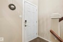 Doorway to outside featuring carpet and baseboards - Edmonton, AB  - Indoor Photo Showing Other Room 
