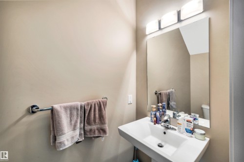 Bathroom featuring toilet and a sink - 8 320 Secord Boulevard, Edmonton, AB - Indoor Photo Showing Bathroom