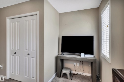 Home office with carpet flooring and healthy amount of natural light - 8 320 Secord Boulevard, Edmonton, AB - Indoor