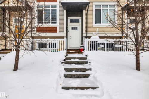 View of snow covered property entrance - 8 320 Secord Boulevard, Edmonton, AB - Outdoor