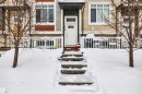 View of snow covered property entrance - 8 320 Secord Boulevard, Edmonton, AB  - Outdoor 