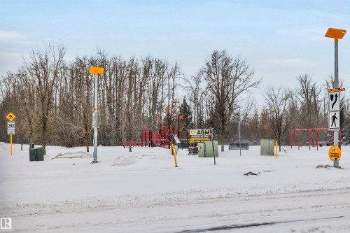 View of yard covered in snow - 8 320 Secord Boulevard, Edmonton, AB - Outdoor