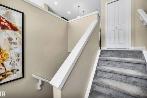 View of stairs - 8 320 Secord Boulevard, Edmonton, AB - Indoor Photo Showing Other Room