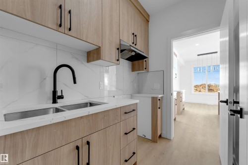 3917 36 Street, Beaumont, AB - Indoor Photo Showing Kitchen With Double Sink With Upgraded Kitchen