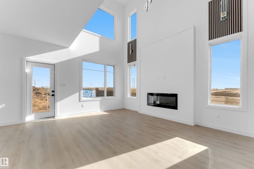 3917 36 Street, Beaumont, AB - Indoor Photo Showing Living Room With Fireplace