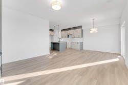 Unfurnished living room featuring light wood-style floors and recessed lighting - 