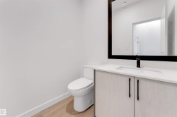 Bathroom featuring vanity and light wood-style flooring - 
