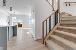 Staircase featuring wood finished floors and baseboards - 
