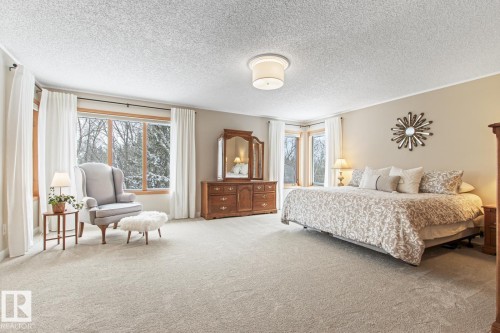 Bedroom with carpet and a textured ceiling - 121 Weaver Drive, Edmonton, AB - Indoor Photo Showing Bedroom