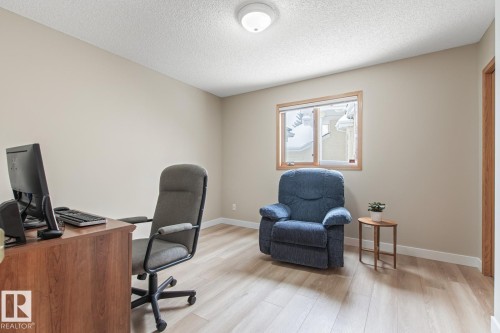 Office space with light wood-style floors and a textured ceiling - 121 Weaver Drive, Edmonton, AB - Indoor Photo Showing Office