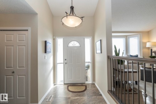 Foyer featuring stone tile floors and a textured ceiling - 932 110A Street, Edmonton, AB - Indoor Photo Showing Other Room