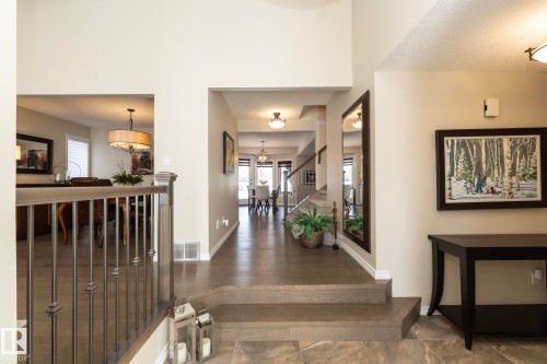 Foyer entrance with stairway and hanging lights - 932 110A Street, Edmonton, AB - Indoor Photo Showing Other Room