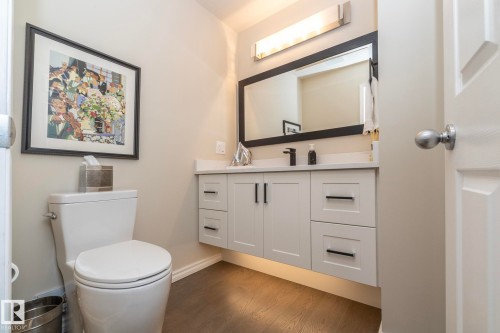 Half bathroom with vanity and dark wood-style floors - 932 110A Street, Edmonton, AB - Indoor Photo Showing Bathroom