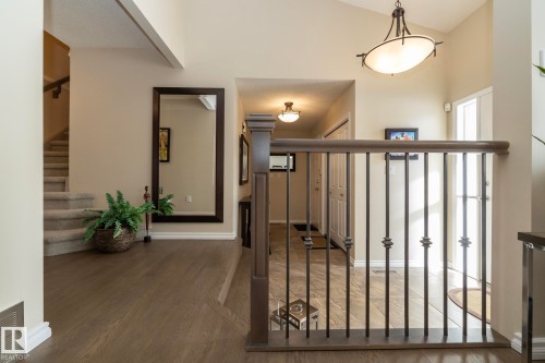 Stairs featuring wood finished floors and a high ceiling - 932 110A Street, Edmonton, AB - Indoor Photo Showing Other Room