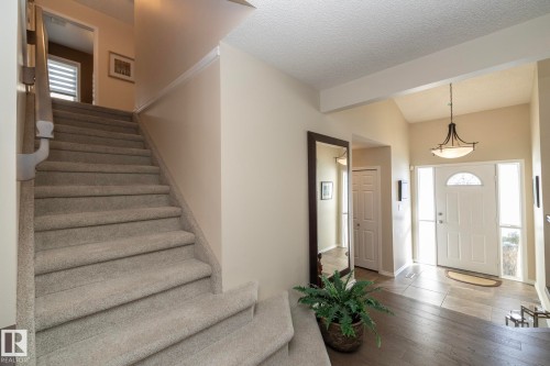 Foyer entrance featuring wood finished floors and beam ceiling - 932 110A Street, Edmonton, AB - Indoor Photo Showing Other Room