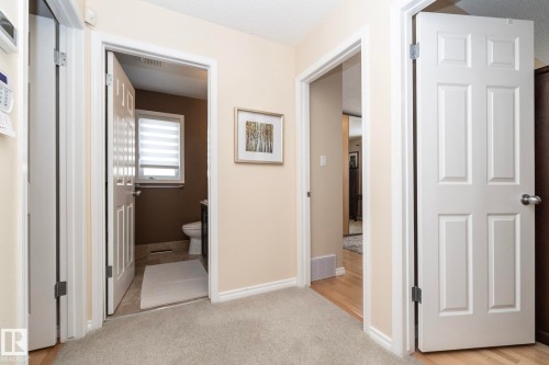 Hall with light carpet and baseboards - 932 110A Street, Edmonton, AB - Indoor Photo Showing Other Room