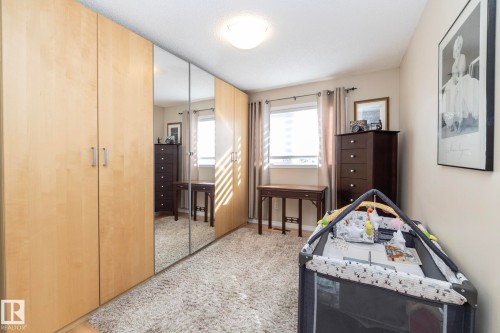 Bedroom with light carpet and baseboards - 932 110A Street, Edmonton, AB - Indoor Photo Showing Bedroom