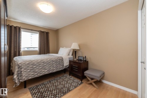 Bedroom featuring light wood finished floors and a textured ceiling - 932 110A Street, Edmonton, AB - Indoor Photo Showing Bedroom