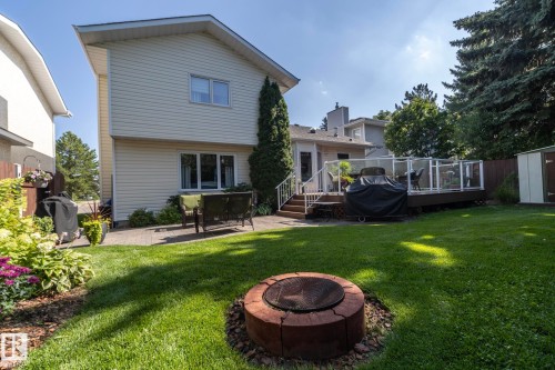 Back of house with a patio, a deck, a storage unit, and a fire pit - 932 110A Street, Edmonton, AB - Outdoor With Deck Patio Veranda
