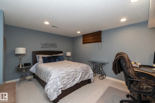 Bedroom with carpet, recessed lighting, an office area, and a textured ceiling - 932 110A Street, Edmonton, AB - Indoor Photo Showing Bedroom