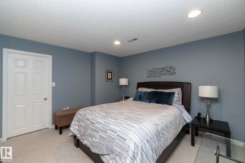 Bedroom with light colored carpet, recessed lighting, and a textured ceiling - 932 110A Street, Edmonton, AB - Indoor Photo Showing Bedroom