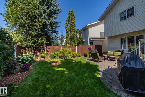 Fenced backyard featuring a fire pit and a patio - 932 110A Street, Edmonton, AB - Outdoor