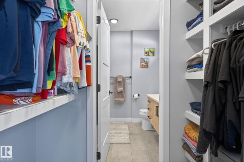 Bathroom with vanity and light tile patterned floors - 9103 120 Avenue, Edmonton, AB - Indoor With Storage