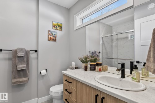 Bathroom featuring a marble finish shower and vanity - 9103 120 Avenue, Edmonton, AB - Indoor Photo Showing Bathroom