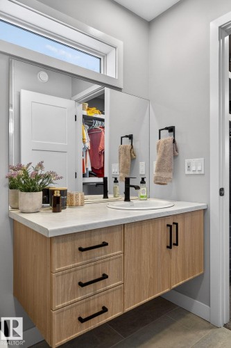 Bathroom with vanity and a walk in closet - 9103 120 Avenue, Edmonton, AB - Indoor
