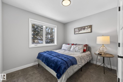 Bedroom featuring dark colored carpet - 9103 120 Avenue, Edmonton, AB - Indoor Photo Showing Bedroom