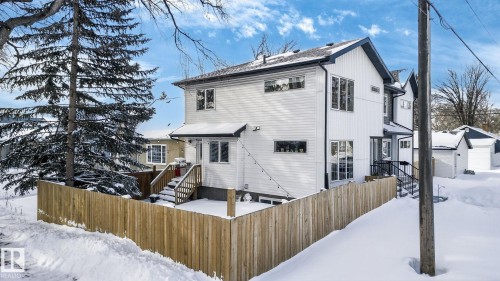 Snow covered back of property featuring an outbuilding - 9103 120 Avenue, Edmonton, AB - Outdoor