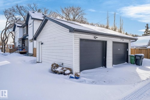 Snow covered garage with a detached garage - 9103 120 Avenue, Edmonton, AB - Outdoor With Exterior