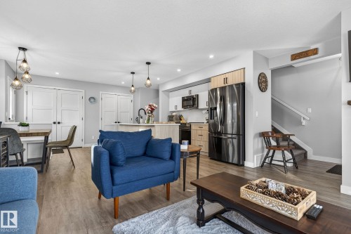 Living room featuring light wood finished floors and recessed lighting - 9103 120 Avenue, Edmonton, AB - Indoor Photo Showing Living Room