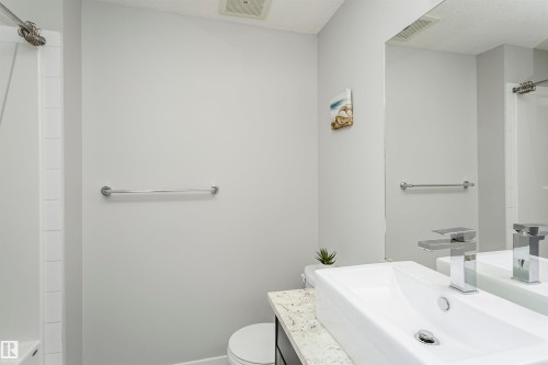 Full bathroom featuring vanity and bathtub / shower combination - 332 5151 Windermere Boulevard, Edmonton, AB - Indoor Photo Showing Bathroom