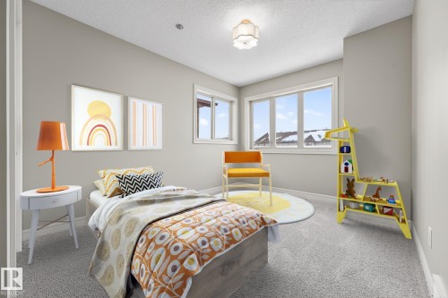Carpeted bedroom with baseboards and a textured ceiling - 2435 Austin Crescent, Edmonton, AB - Indoor Photo Showing Bedroom