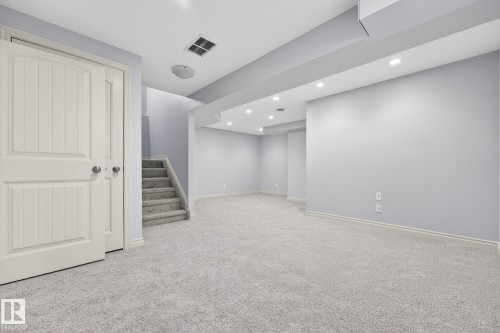 Finished basement featuring light colored carpet and recessed lighting - 2435 Austin Crescent, Edmonton, AB - Indoor Photo Showing Other Room