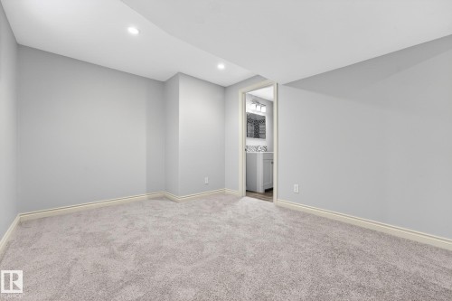 Unfurnished bedroom featuring carpet, recessed lighting, and ensuite bath - 2435 Austin Crescent, Edmonton, AB - Indoor Photo Showing Other Room